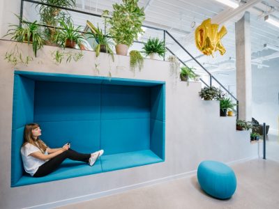 woman-with-phone-in-cozy-niche-in-office-2025-04-04-03-28-38-utc